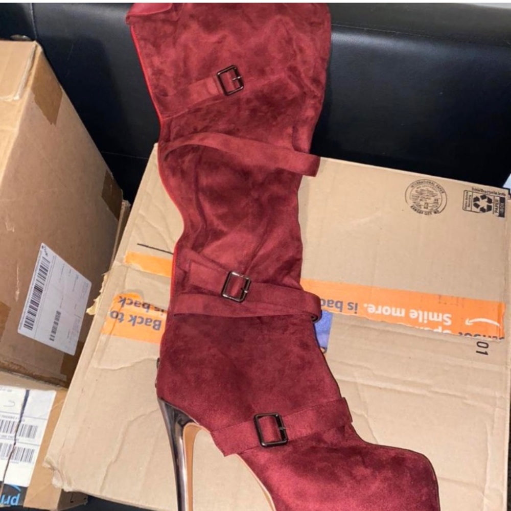 Women’s size 14 tall suede buckled high hell boots. Like new. Never worn.